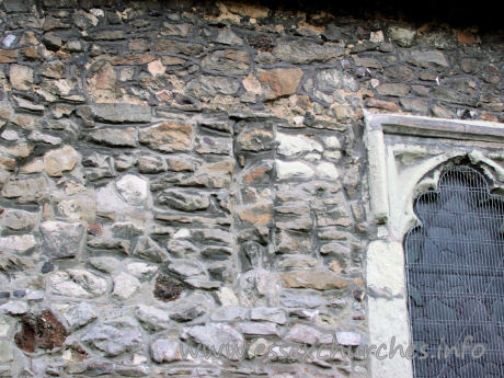 St Mary & All Saints, Great Stambridge Church - Clearly visible here, is one of the very narrow, blocked 
windows.
