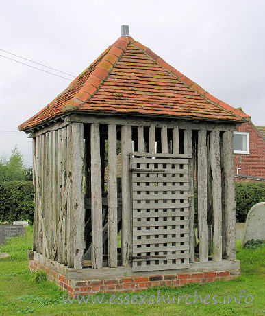 All Saints, Wrabness Church - 


This is the Wrabness bell tower. Though it is really more of a 
bell cage. It is likely dated in either C17 or C18. Pevsner describes it as 
being like a village lock-up.













