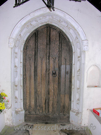 St Michael, Ramsey Church - 


The S doorway is C15. One order of fleurons, the other of a 
king, queen and small shields.













