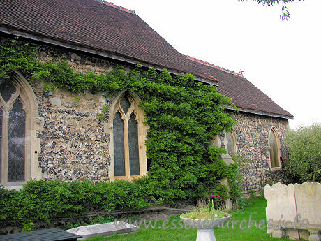 St James, West Tilbury Church - 


The S side of the church. Nigel, the new owner of St James', 
told me that this plant covering the wall is wisteria. It must look lovely with 
it's cascading lilac blooms.











