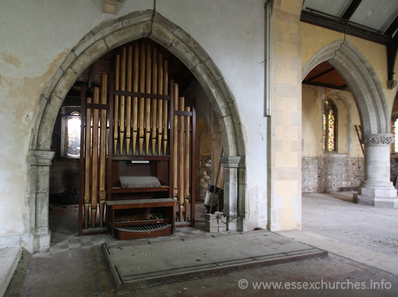 St John the Baptist, Mucking Church - The organ in the arcade seperating the chancel and S chapel.