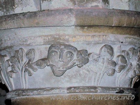 St Giles, Mountnessing Church - Pevsner mentions that the capitals are moulded, except for 
one, which he says is enriched by stiff leaf. He seems to have missed the 
unusual figure completely!



