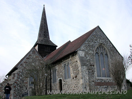 St Nicholas, Laindon Church - This view shows, in addition to Julie, the C14 chancel and S 
chapel. The church was open when we arrived, but a christening was taking place. 
As this was visited in January, the days were rather short, so we didn't waste 
time waiting for it to finish.




