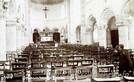 Our Lady of Light (Catholic), Clacton  Church - The neo-Norman style is highly evident here, with the low circular piers, the crossing with crossing tower, the transepts with an eastern aisle, and the apse with a narrow ambulatory.