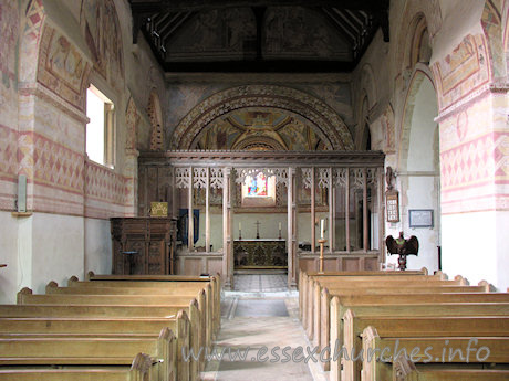 St Michael & All Angels, Copford Church - Looking towards the chancel, from the W end of the nave. Clearly visible here are four springers, which once supported the Norman barrel vaulting. Two can be seen either side of the screen, whilst the other two are clearly visible at both upper corners of the image.